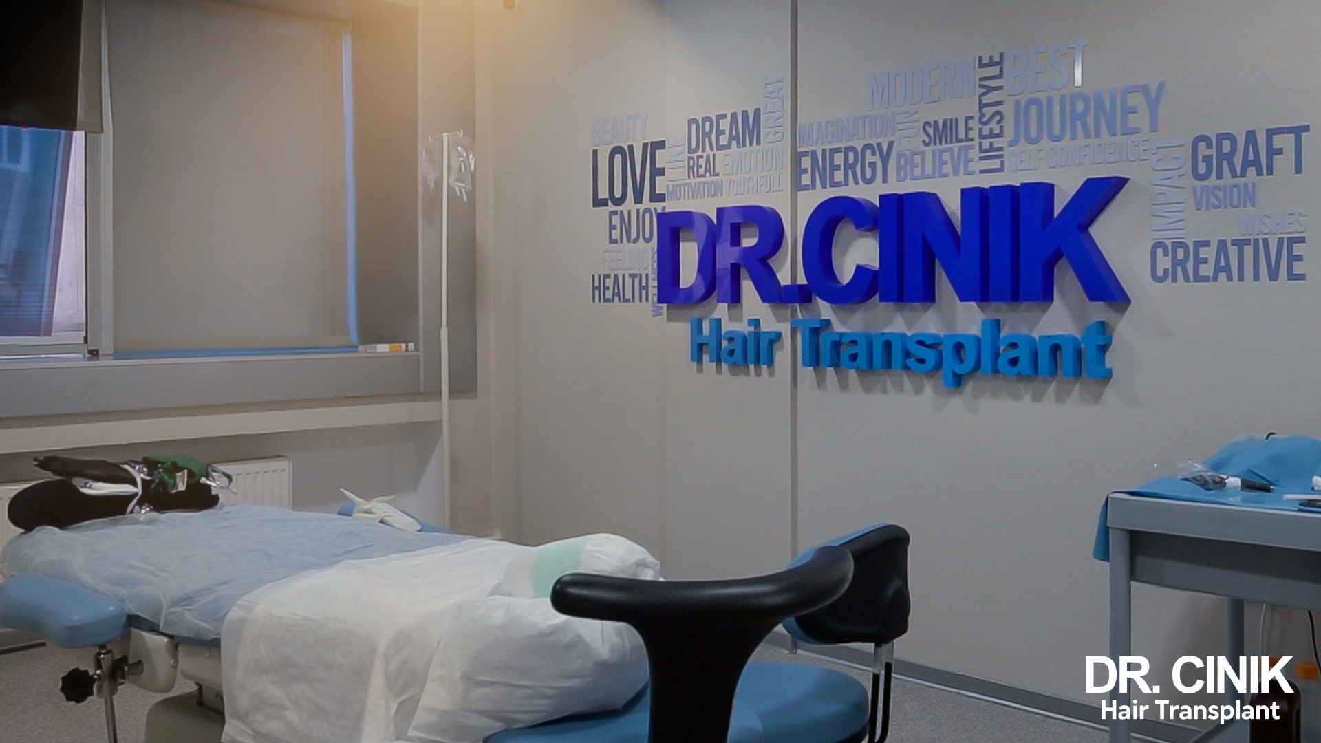 Operating room at the Dr Cinik clinic prepared before a transplant, draped operating table and wall logo
