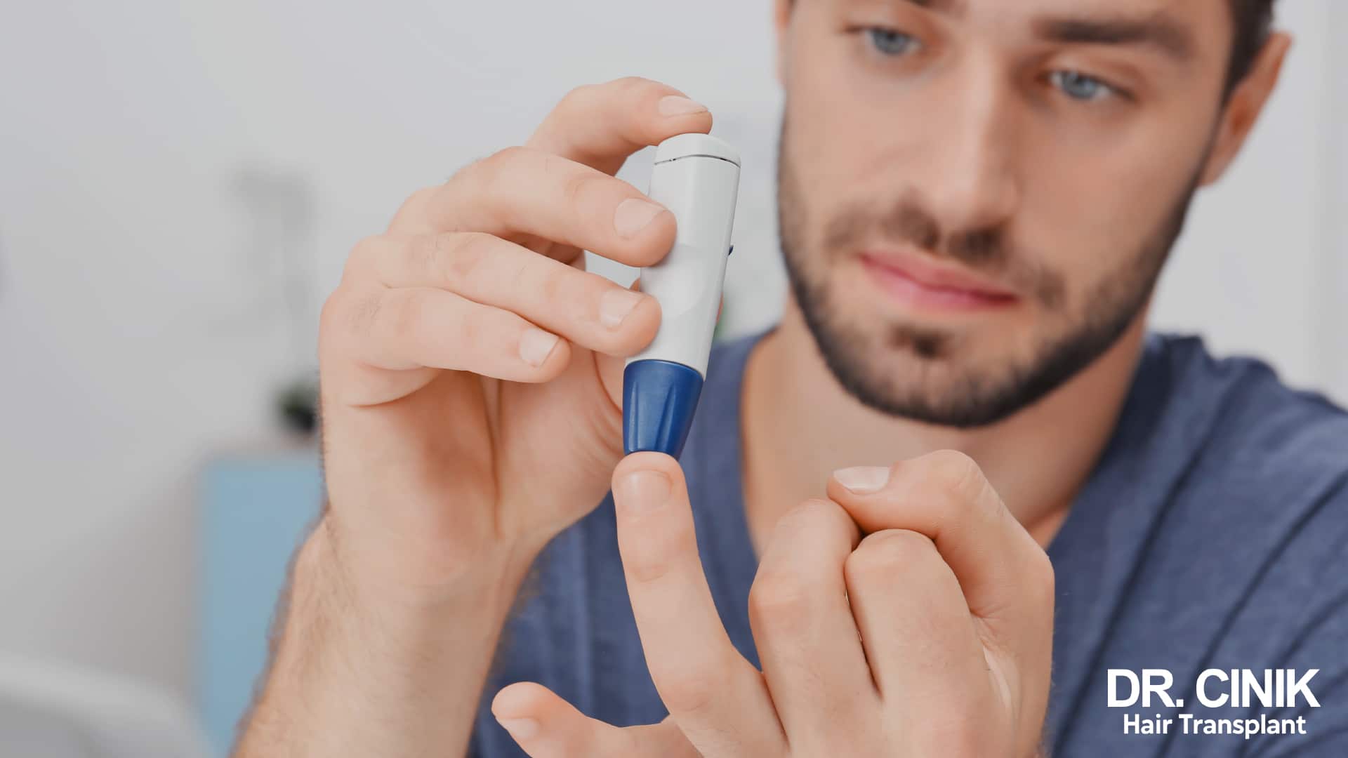 Man holding a lancing device against his finger to check his blood sugar
