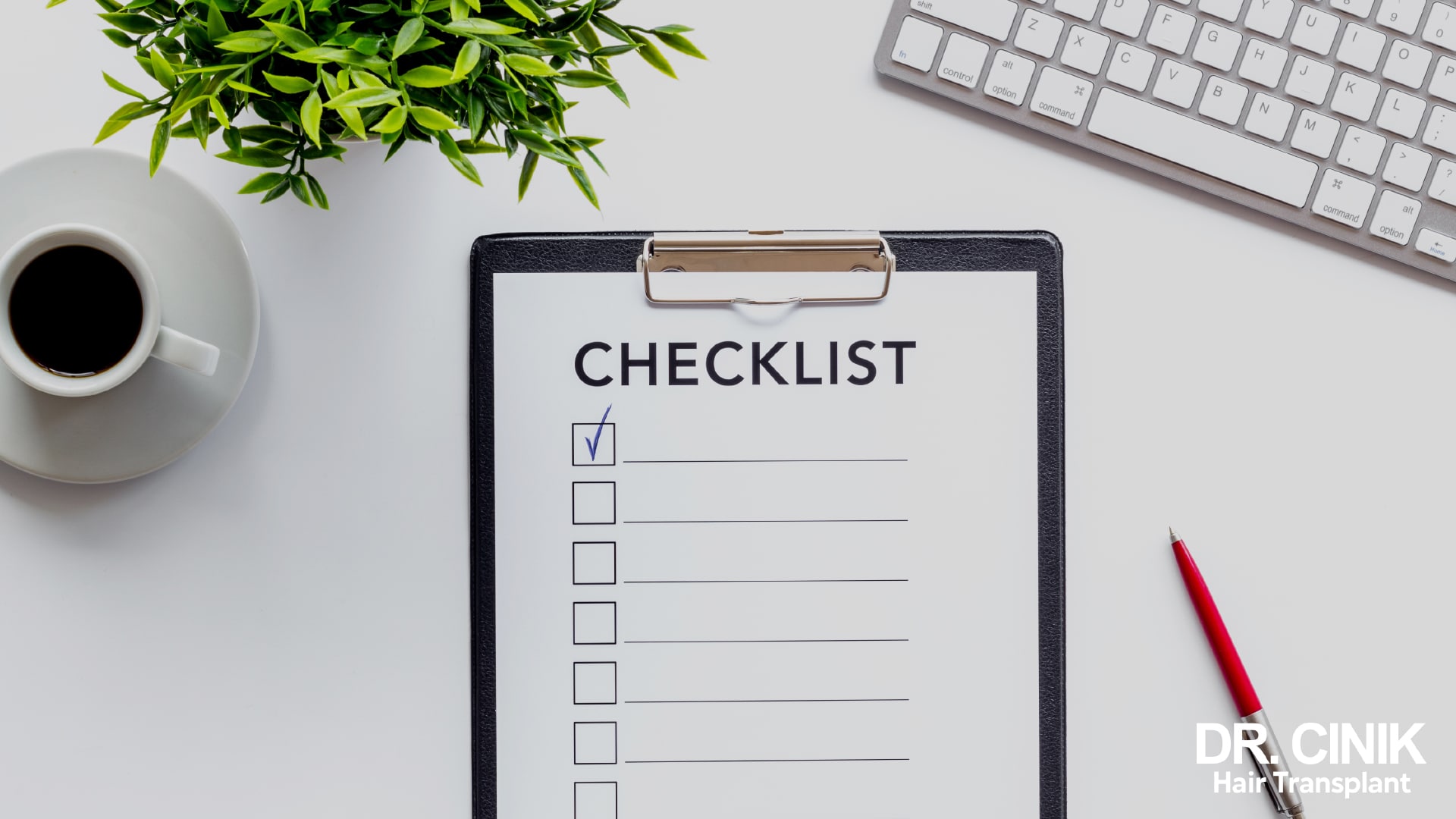 Notepad on a desk with a list headed CHECKLIST, one box ticked, red pen and a cup of coffee beside it