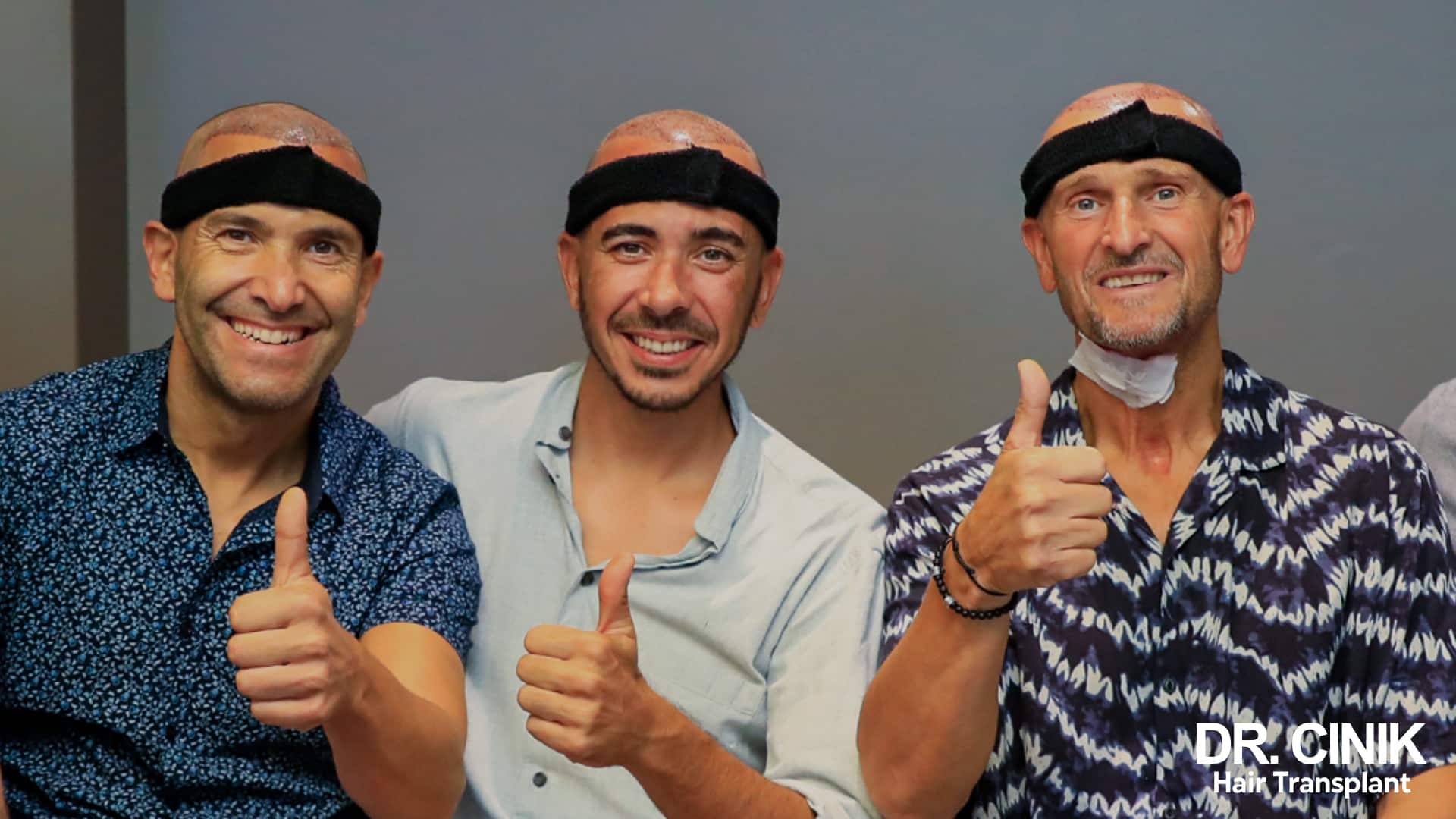 Three smiling patients each wearing a black forehead band after their procedure, thumbs up