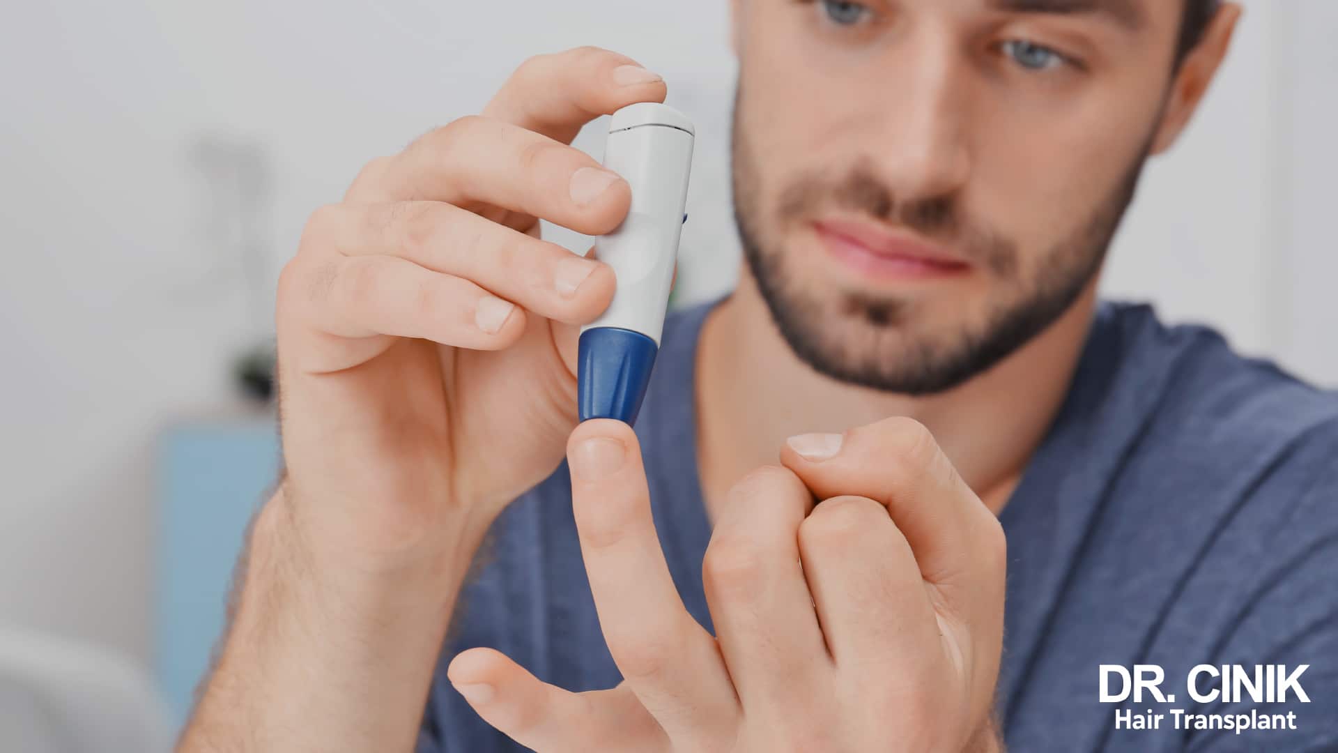 Man measuring his blood sugar from a fingertip with a handheld meter
