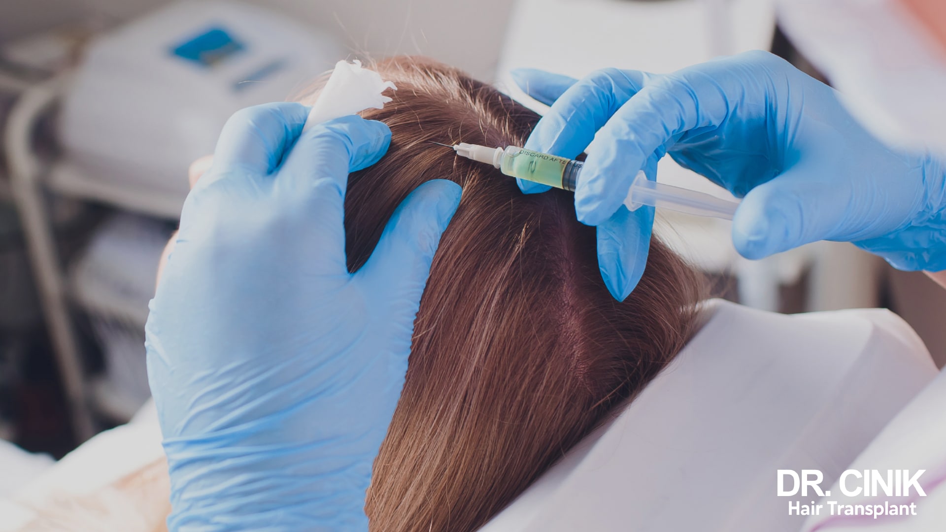 Gloved practitioner giving an injection right at the surface of a patient's scalp