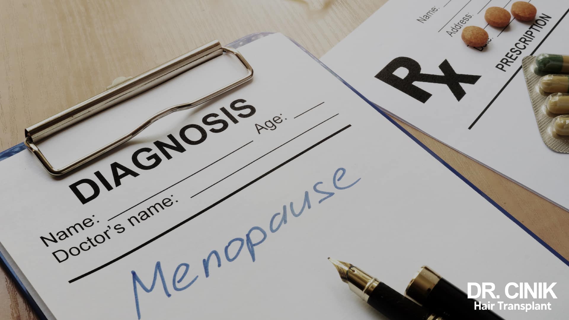 Medical assessment form with the word menopause handwritten on it by a doctor, lying next to a prescription and some capsules