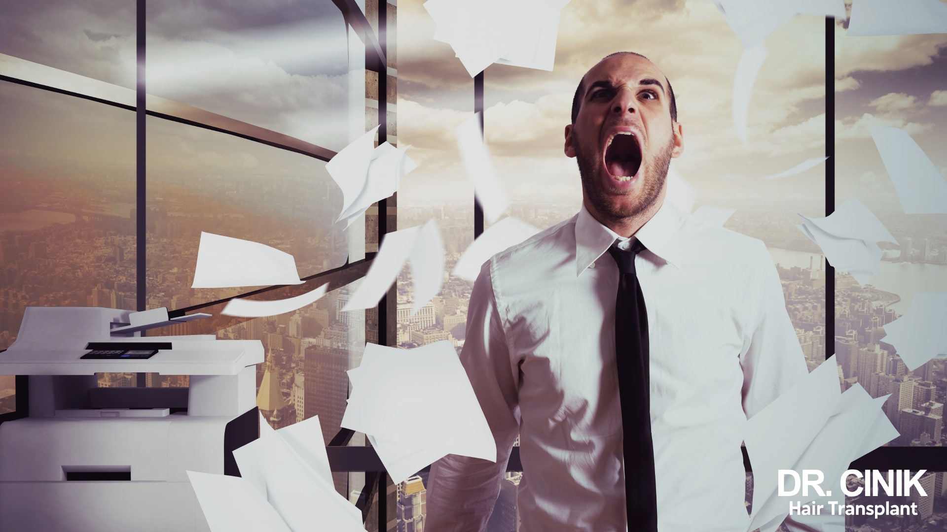 Man in shirt and tie shouting in a high-rise office, surrounded by sheets of paper flying through the air